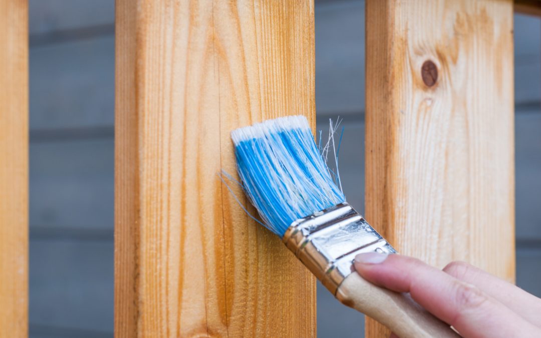 paintbrush painting wood furniture legs